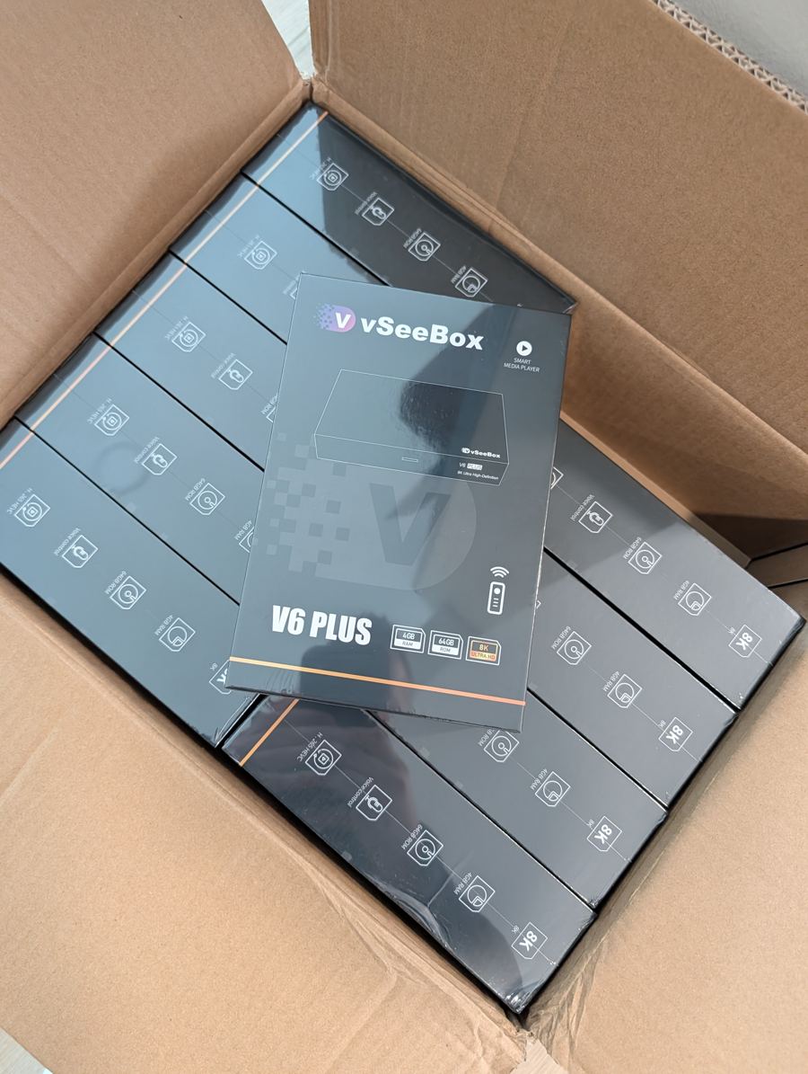 A fresh carton of VSeeBox V6 Plus units being unpacked